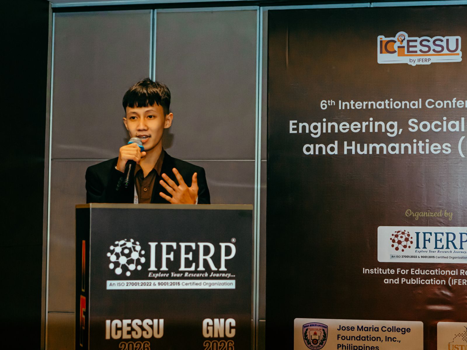 A presenter addressing the conference from the IFERP lectern